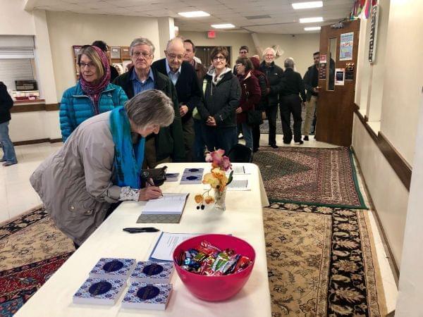 Champaign-Urbana community members enter the Central Illinois Mosque and Islamic Center for a vigil in remembrance of the victims of the Christchurch attack.