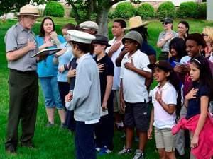 A park ranger talking to some young people