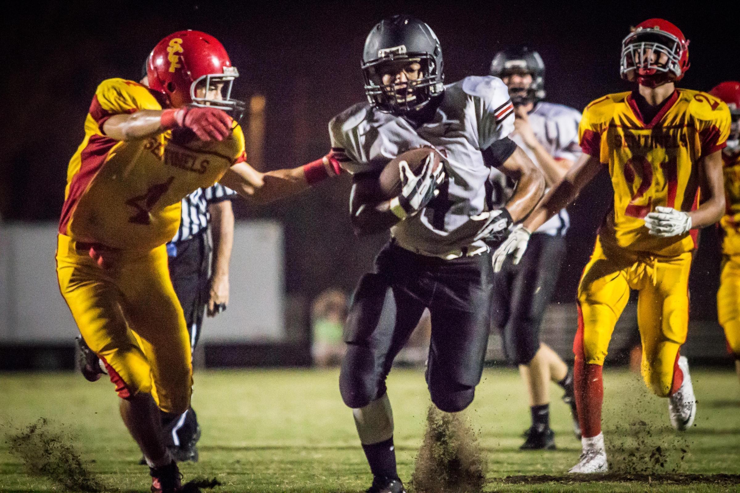 High school football players in a game.