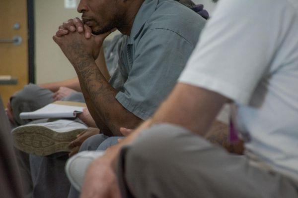 Men at the Eastern Reception, Diagnostic and Correctional Center in Bonne Terre, Mo. listen to a philosophy discussion hosted by the St. Louis University Prison Program.