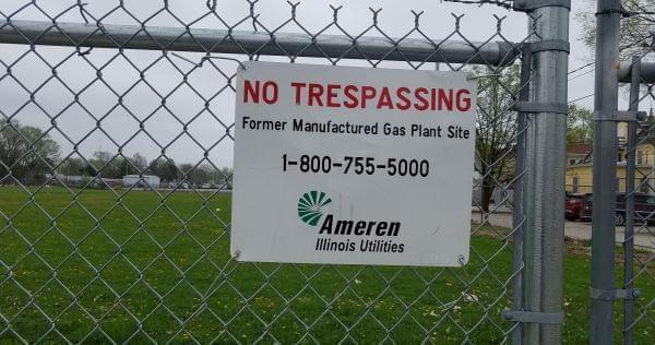 Sign on the fence surrounding the manufactured gas plant site owned by Ameren in Champaign.