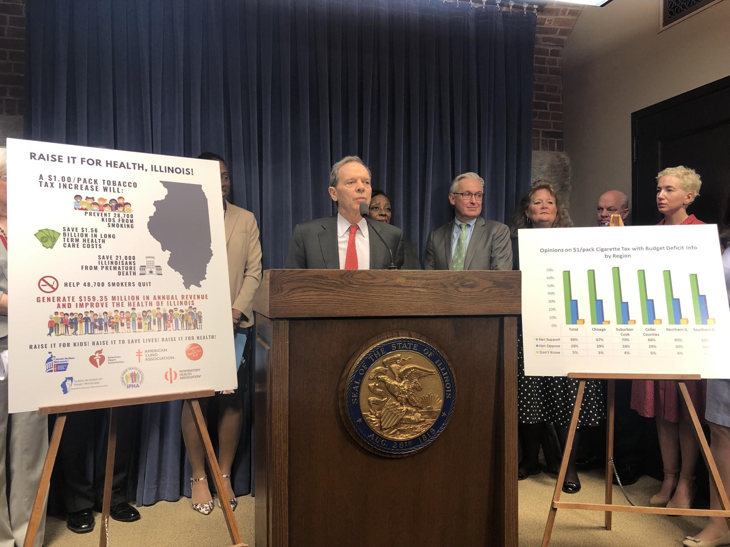 Senate President John Cullerton, surrounded by health professionals and fellow Democrats, calls for higher taxes on tobacco products.