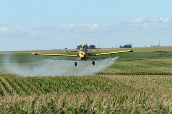 Fleets of specially-equipped planes can spray pesticides on cropland, including this Air Tractor owned by Meyer Agri-Air in Wellsburg, Iowa.