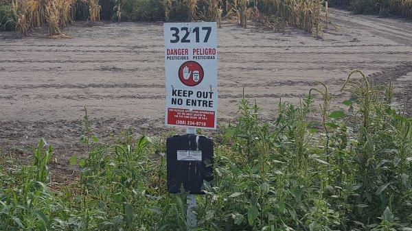 An EPA investigation found this sign in a Nebraska field. It provides information about pesticide applications in the area.