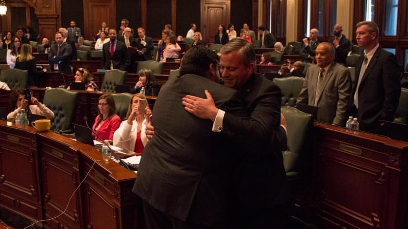 Gov. J.B. Pritzker, left, hugs state Rep. Robert Martwick after passage of a constitutional amendment to allow for a graduated income tax in Illinois. 