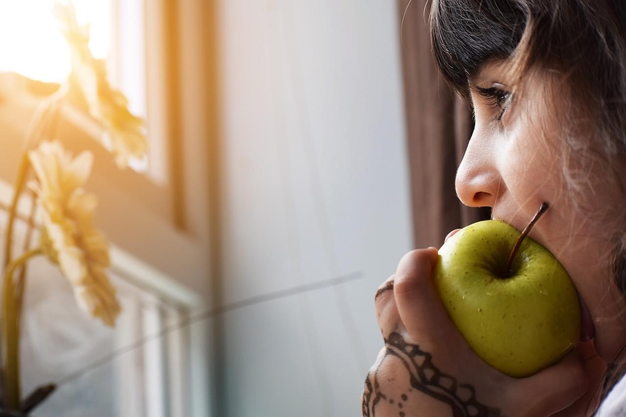 child eating apply
