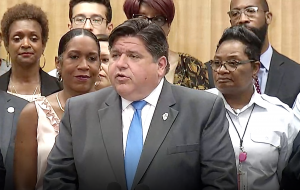 Gov. J.B. Pritzker addresses a crowd during a press event on Illinois' newly-signed state infrastructure plan in Chicago.