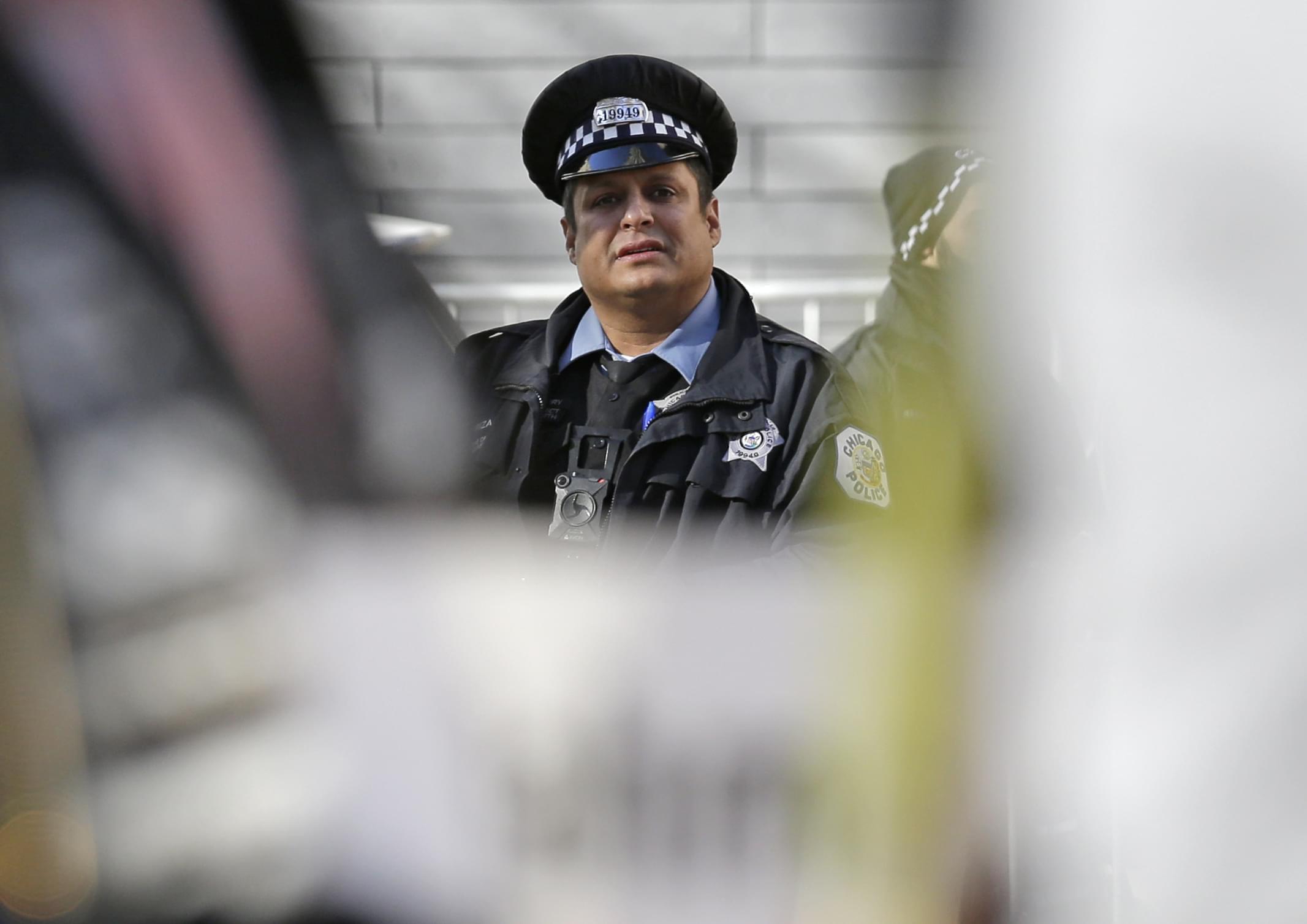 A Chicago police officer looks to protesters during a Nov. 24, 2017 "march for justice."