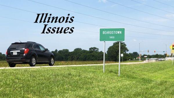 A car approaching a road sign for the city limits of Beardstown.