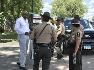 At left, Attorney General Kwame Raoul speaks with Illinois State Troopers following an event at the Illinois State Fair on Aug. 14.
