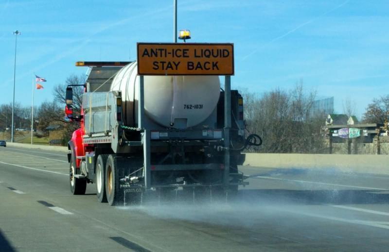 A brining truck sprays saltwater on the roadways ahead of a winter storm in December 2016.