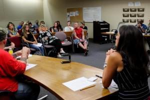 Judge Jodi Thomas, right, speaks to HART participants during a weekly meeting.