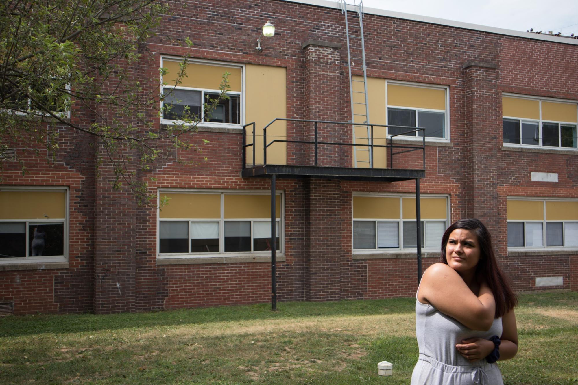 Yuliana Quintana, 19, stands outside DePue High School. DePue Community Unit School District 103 has only about half the money the district needs to provide students an adequate education.