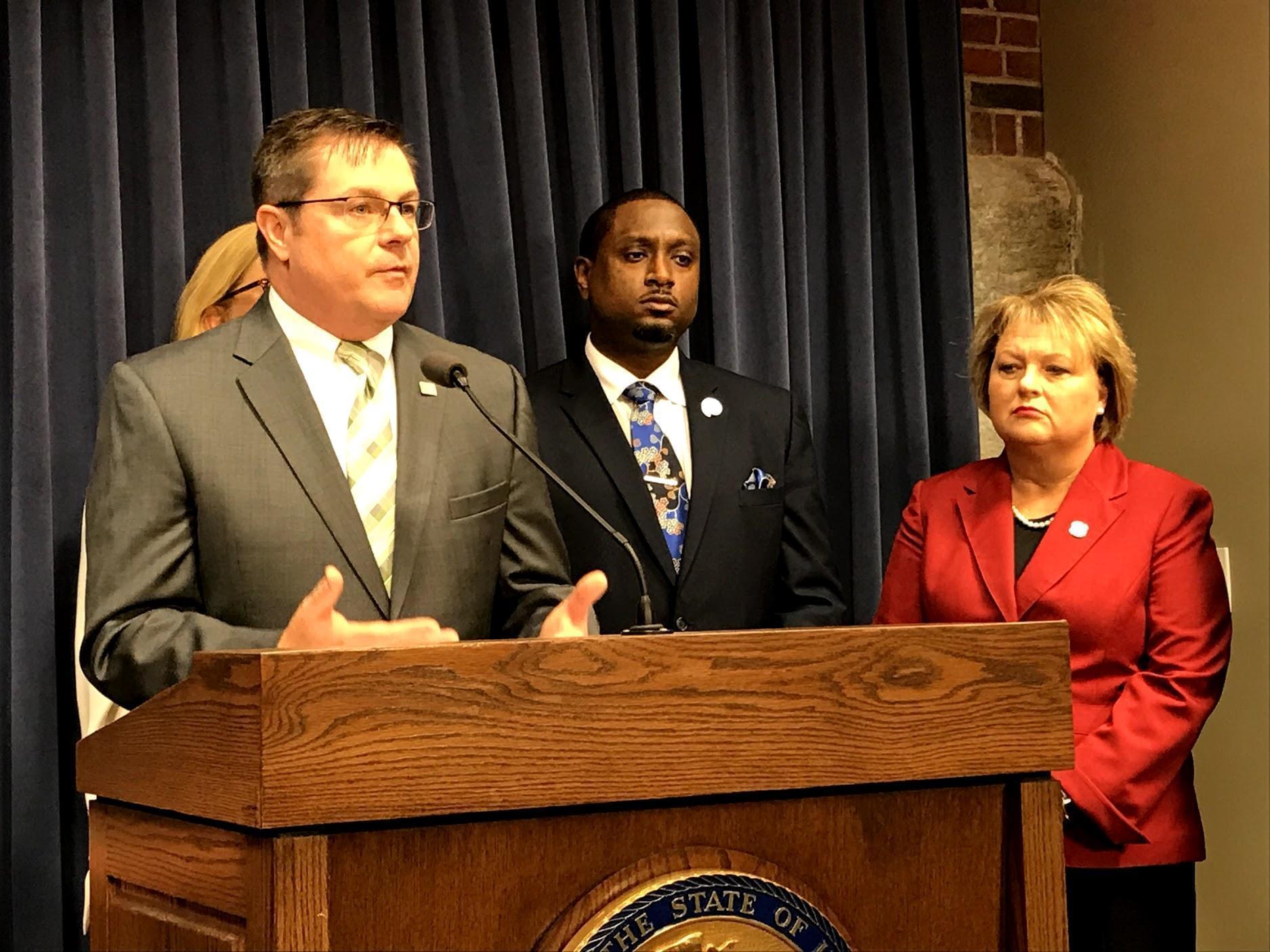 Rep. Grant Wehrli addresses the media on Oct. 28. At right, Democratic state Rep. Maurice West