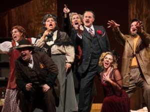 The Opera Delaware Ensemble performs Gianni Schicchi & Buoso’s Ghost on a stage.