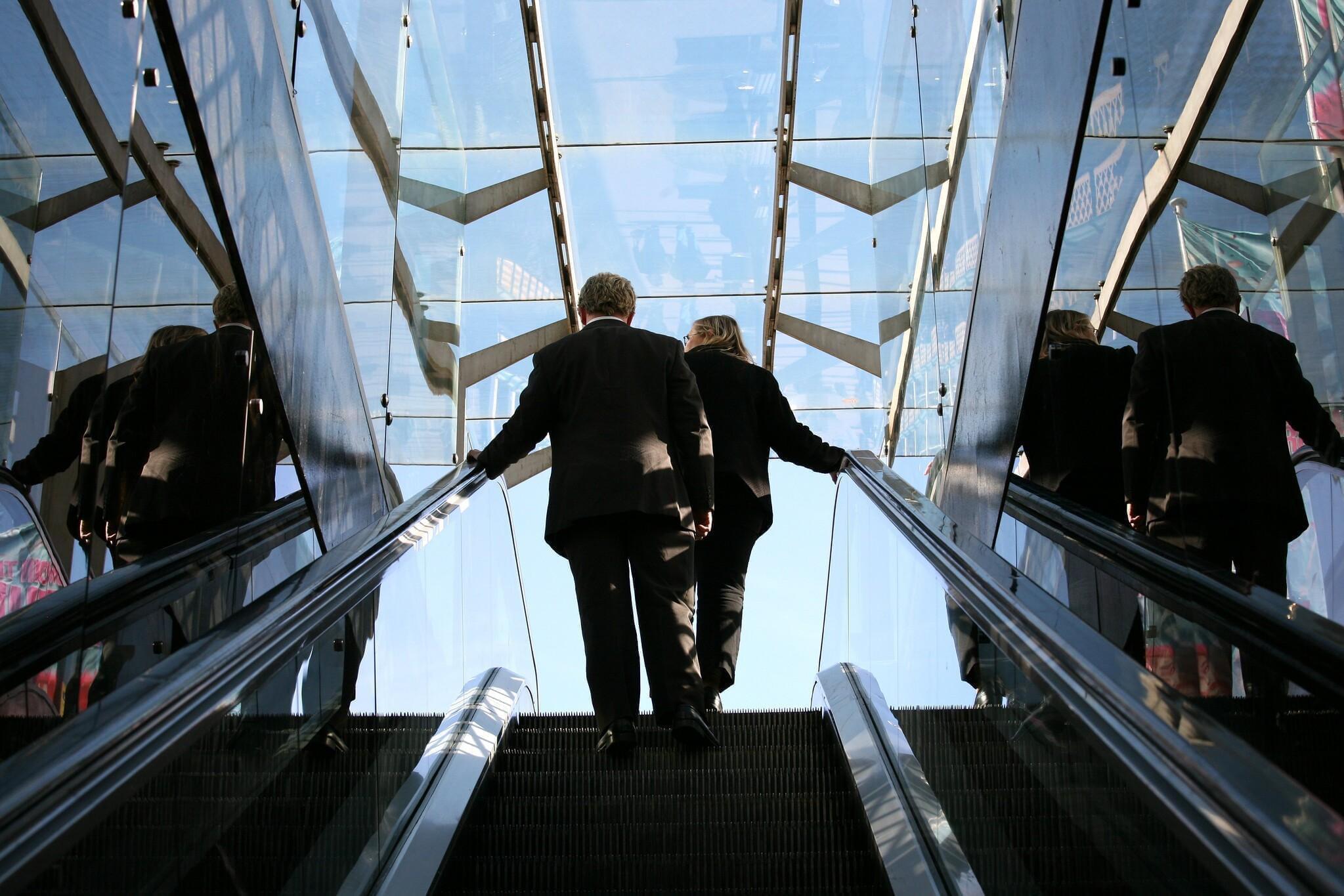 People on an escalator.