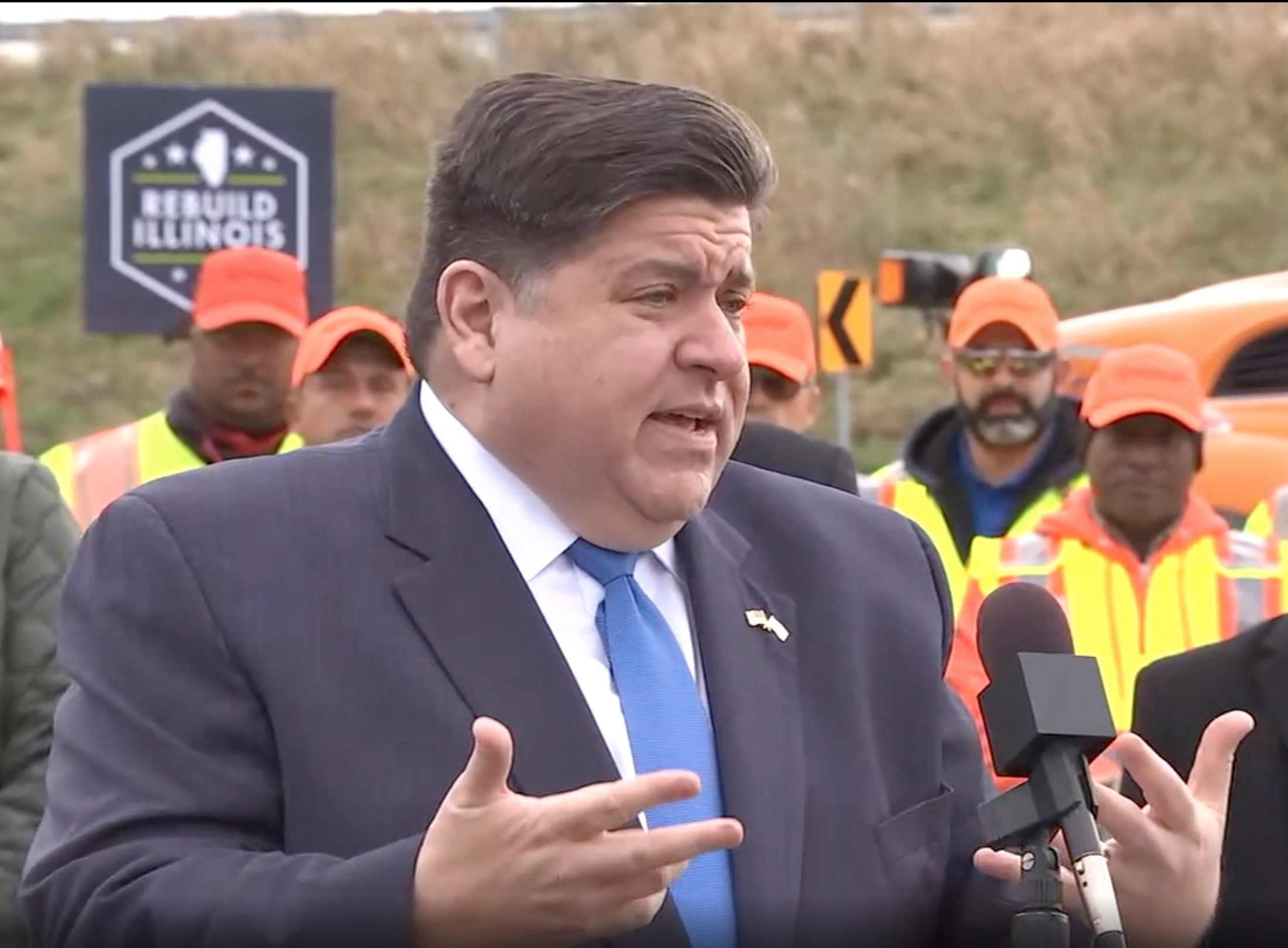 Gov. Pritzker speaks to a crowd at an event in Will County on Nov. 6.