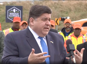 Gov. Pritzker speaks to a crowd at an event in Will County on Nov. 6.