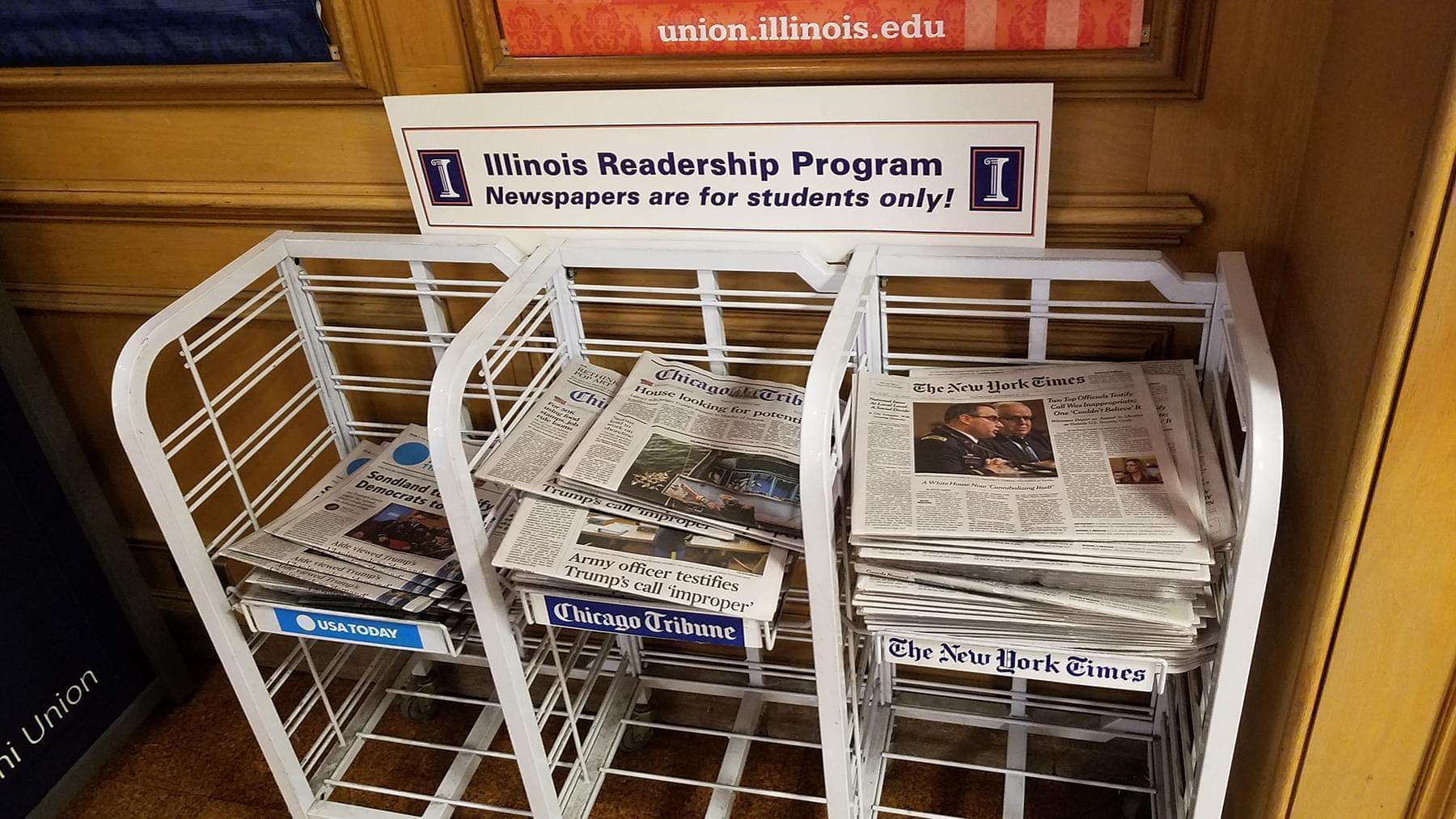 A newspaper rack for the Illinois Readership Program at the University of Illinois Illini Union.
