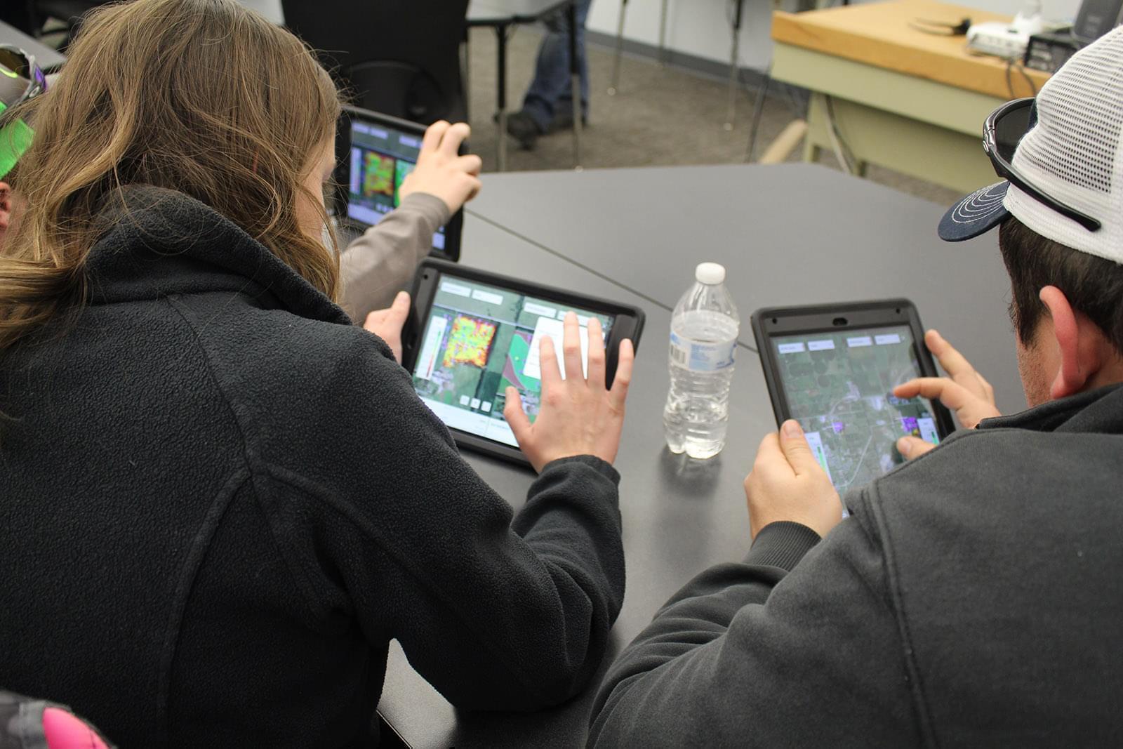 Students analyze soil data from this year's experimental soybean crop.