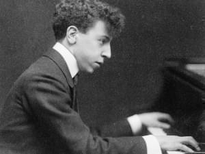 Arthur Rubinstein playing the piano.