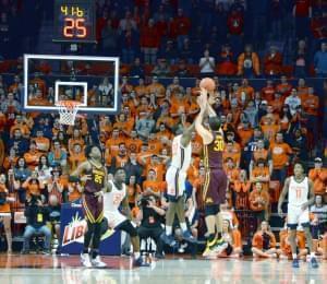 Da'Monte Williams blocks a game-tying attempt by Minnesota's Alihan Demir late in the Illini's 59-51 win on Thursday.