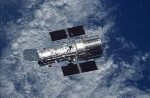 The Hubble Space Telescope orbiting above the Earth