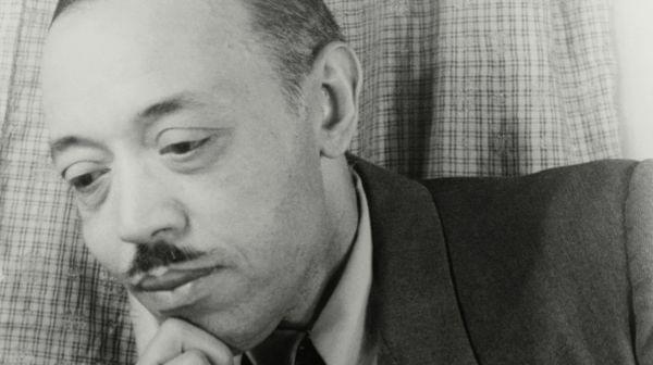 William Grant Still up close with hand on chin