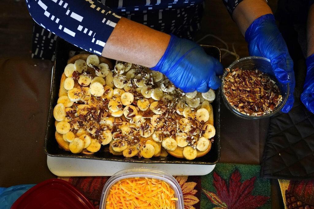 On any other Thanksgiving, dozens of Olga Garcia's family members would squeeze into her home for the holiday. But this year, everyone will sit down to eat in their own homes at precisely 6:30 p.m. and join a group phone call.