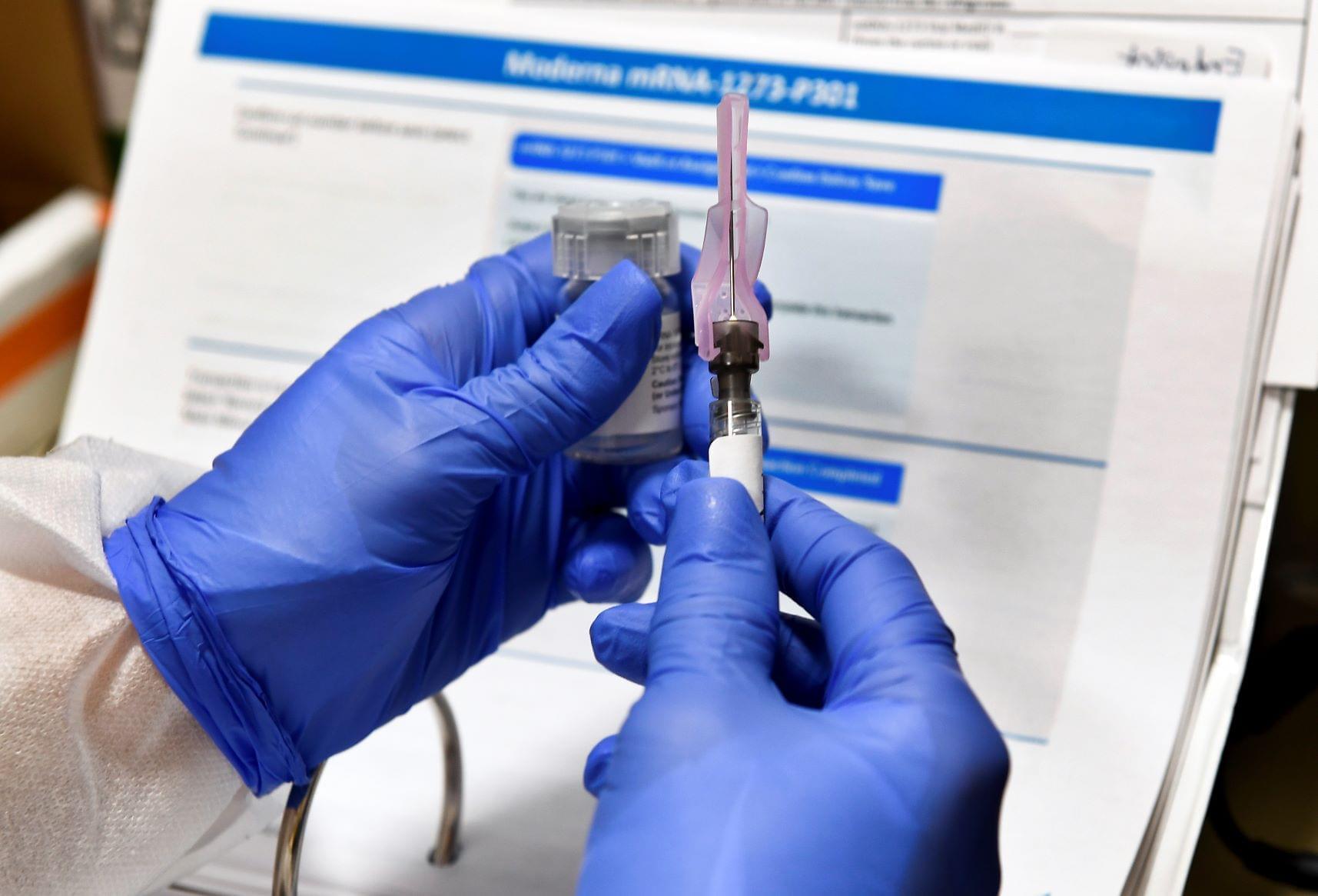 a nurse fills a syringe with a dose of the Johnson & Johnson's one-dose COVID-19 vaccine at the Vaxmobile, at the Uniondale Hempstead Senior Center, in Uniondale, N.Y. New Yorkers over 16 years old can sign up for COVID-19 vaccinations starting Tuesday, April 6 a major expansion of eligibility as the state seeks to immunize as many people as possible.