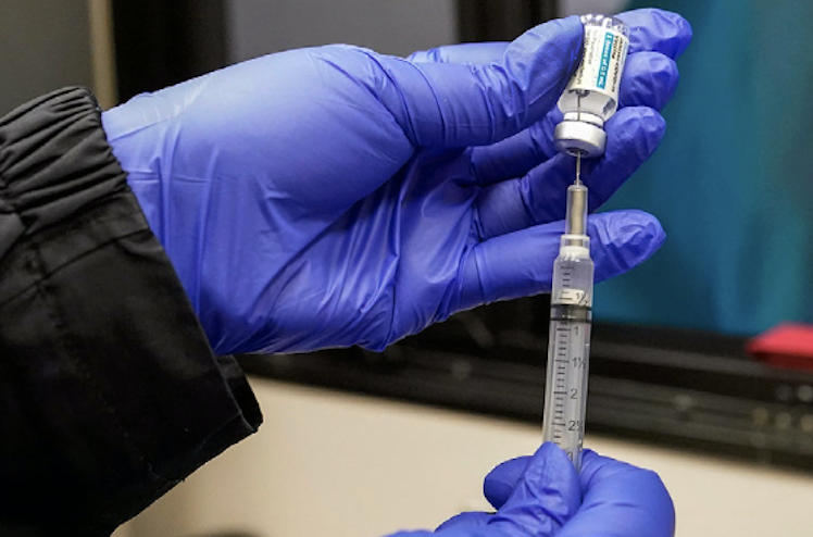 In this March 31, 2021 file photo, a nurse fills a syringe with a dose of the Johnson & Johnson's one-dose COVID-19 vaccine at the Vaxmobile, at the Uniondale Hempstead Senior Center, in Uniondale, N.Y. New Yorkers over 16 years old can sign up for COVID-19 vaccinations starting Tuesday, April 6 a major expansion of eligibility as the state seeks to immunize as many people as possible.