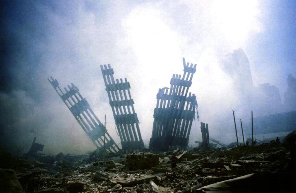 The remains of the World Trade Center stands amid the debris in New York, Tuesday, Sept. 11, 2001.