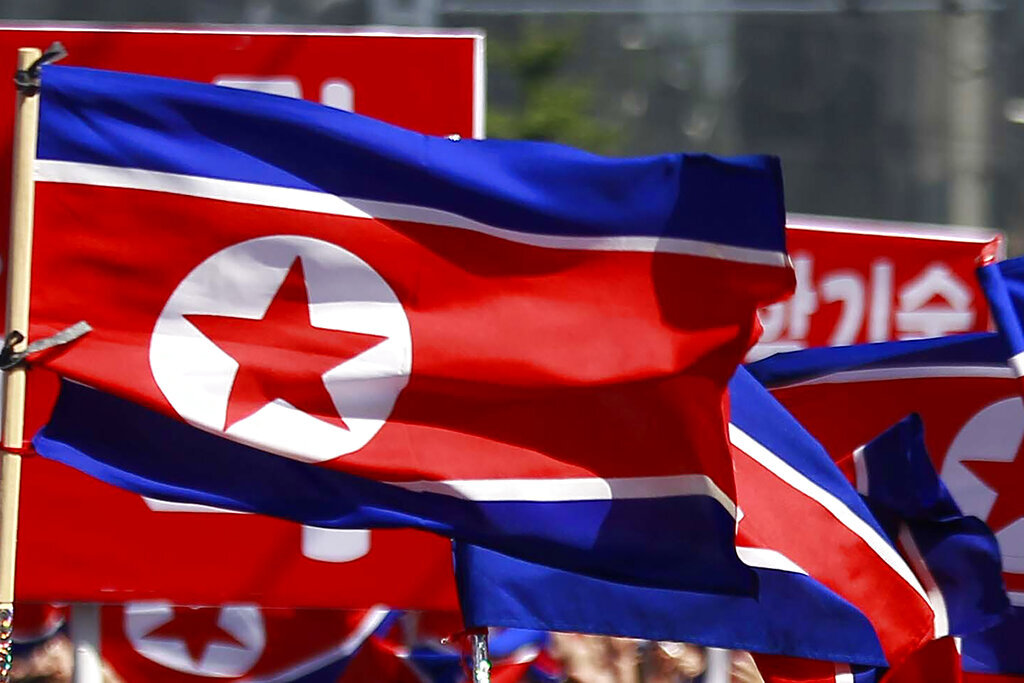 North Korean flags are carried during a celebration of the nation's 73rd founding anniversary in Pyongyang, North Korea on Sept. 9, 2021.