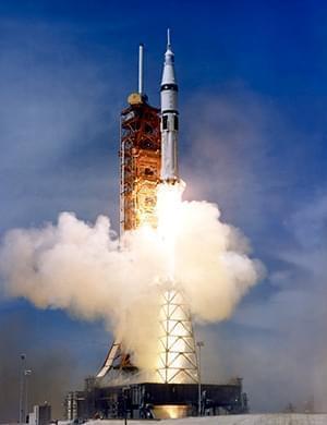 Apollo rocket taking off from launch pad