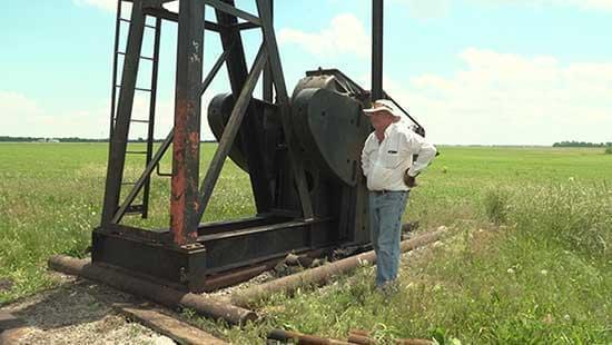 Cliff Mansfield surveys an oil well he shut down when the pandemic began