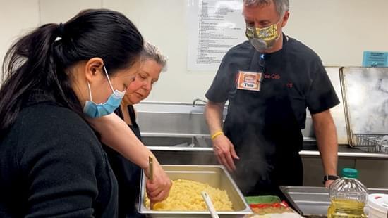 Volunteers prepare food for Jubilee Cafe at Community United Church of Christ, Champaign.