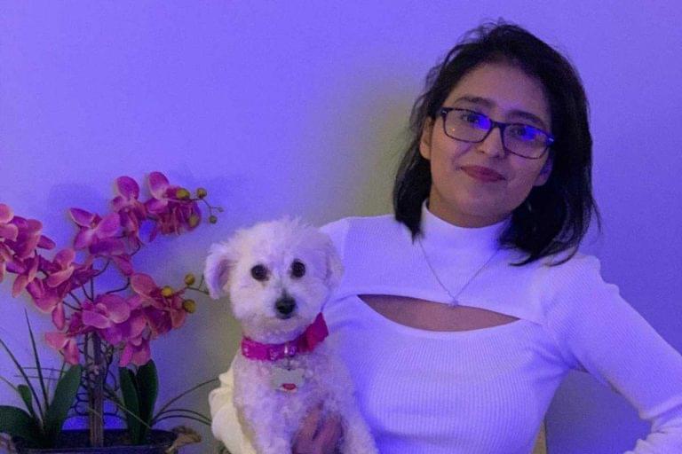 After contracting COVID-19 and ending up on life support, Mayra Ramirez received a double-lung transplant on June 5, 2020, at the age of 28. She poses with her dog in this photo taken in January 2021.