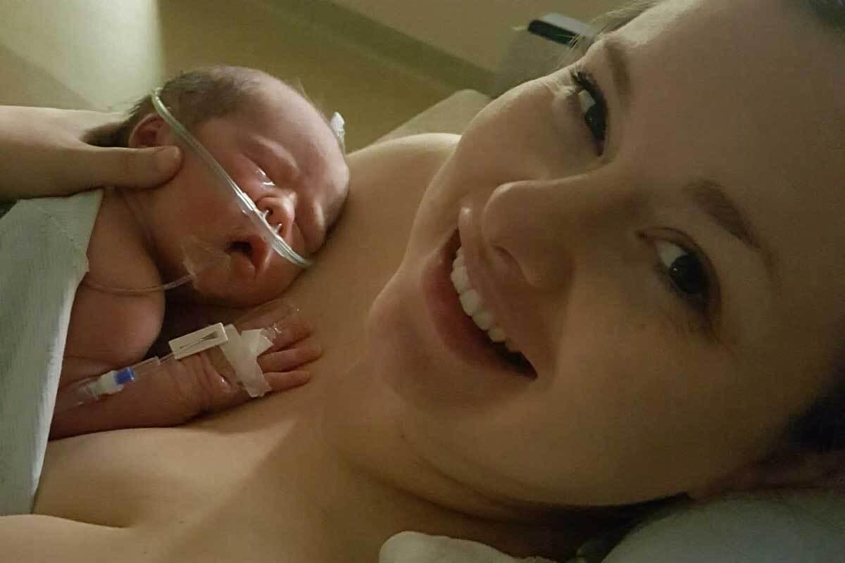 Paige Raab holds her baby in the neonatal intensive care unit. Her experience with two traumatic births and NICU stays led her to create the new nonprofit group,