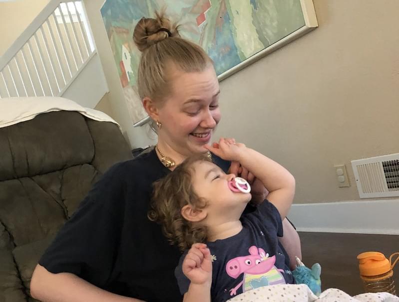 Shaersti Anderson and her daughter Raelynn bond after Anderson picks Raelynn up from daycare. Anderson said that balancing taking care of Raelynn and doing her school work has not been easy, especially since the transition to online classes.