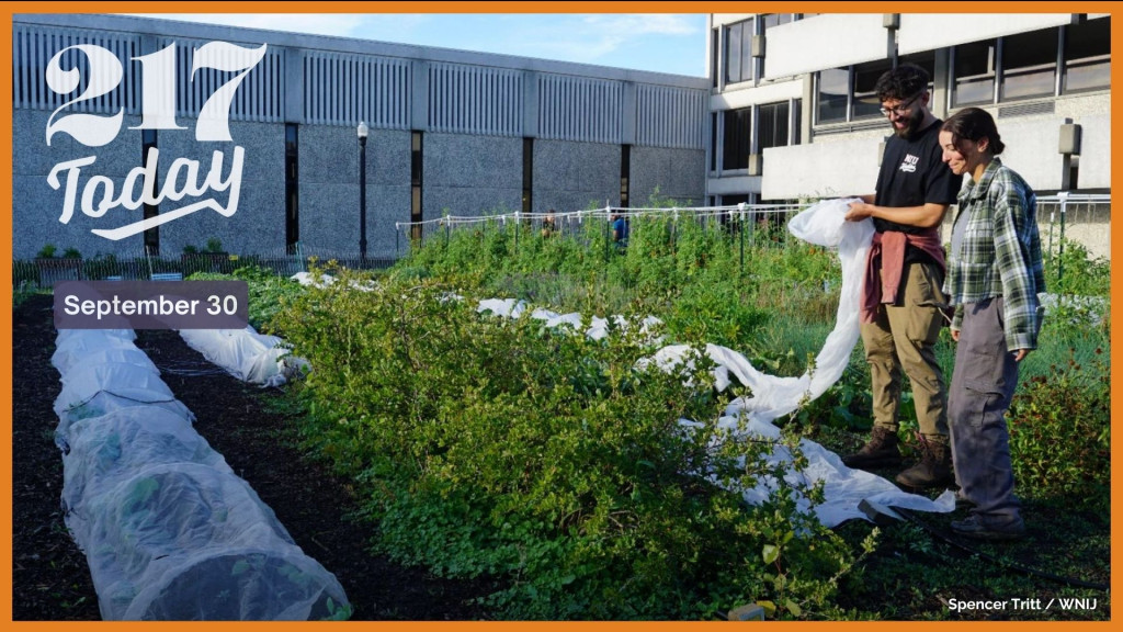 Laura Fehling (right), project coordinator for Northern Illinois University's Edible Campus, and volunteer Matthew McCanna-Molina, stand in one of the campus' gardens. The program provides free fruits and vegetables to students and community members.