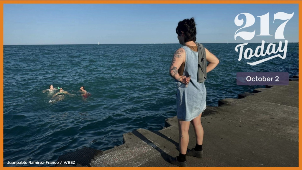 Annelise Rittberg watches as their four friends enjoy a late summer dip in Lake Michigan just south of Belmont Harbor. 