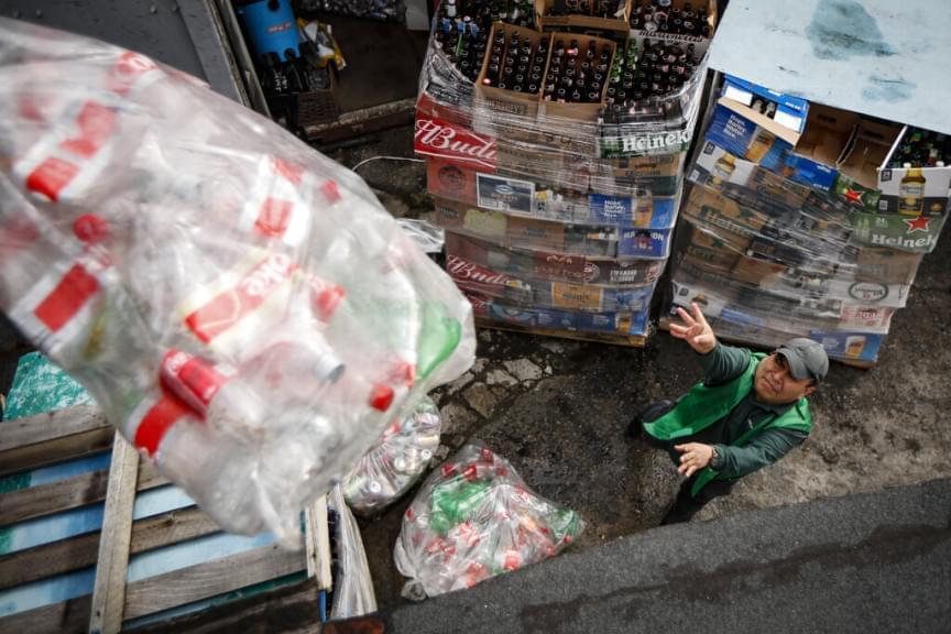  Manuel Rene Del Carmen organizes bags of recyclables and throws them into their allotted storage spaces at the Sure We Can recycling depot, Thursday, Feb. 27, 2020, in the Bushwick neighborhood of New York.