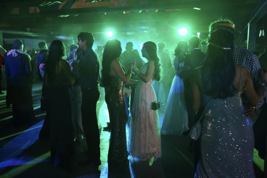 Young people dance during prom at the Grace Gardens Event Center in El Paso, Texas on Friday, May 7, 2021. Around 2,000 attended the outdoor event at the private venue after local school districts announced they would not host proms this year. Tickets cost $45.