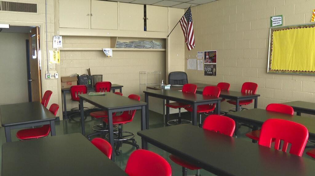 In this image made from video, an empty classroom is shown at David Ellis Academy in Detroit, Monday, Feb. 8, 2021.