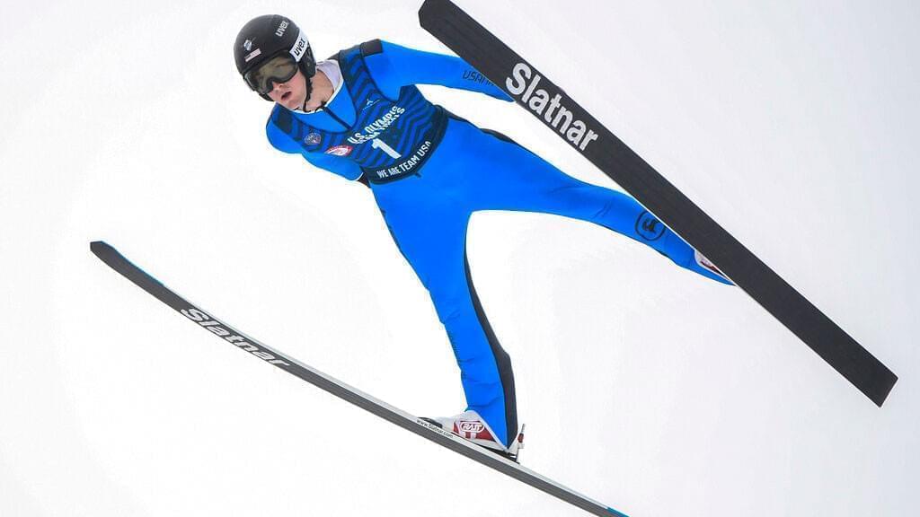 Kevin Bickner soars through the air during the men's ski jumping competition at the Olympic Ski Jumping Complex in Lake Placid, N.Y., Saturday, Dec. 25, 2021. Bickner won the U.S. trials last month, helping him earn a trip to the Olympics for the second time. The 25-year-old Bickner, who learned how to jump in suburban Chicago at the Norge Ski Club, finished 18th on the normal hill and 20th on the large hill at the Pyeongchang Games.
