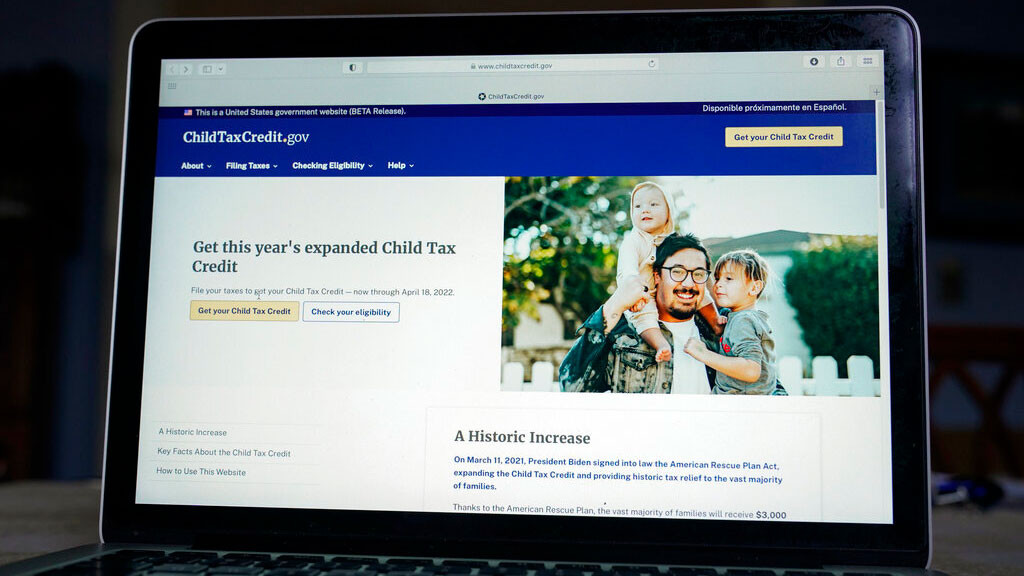 The government website childtaxcredit.gov is photographed on a computer screen Monday, Jan. 24, 2022, in Annapolis, Md. The IRS has launched a revamped Child Tax Credit website meant to steer people to free filing options for claiming the credit. The website includes a new tool that will help filers determine their eligibility and how to get the credit.