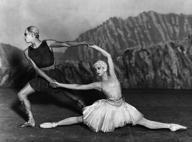 A scene from Stravinsky's ballet, Apollo, featuring two dancers positioned in geometric poses.