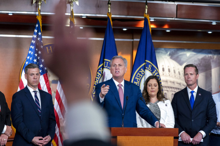 House Minority Leader Kevin McCarthy, of Calif., left, responds to a reporter during a news conference on the House Jan. 6 Committee, Thursday, June 9, 2022, with Rep. Elise Stefanik, R-N.Y., and Rep. Rodney Davis, R-Ill., on Capitol Hill in Washington.