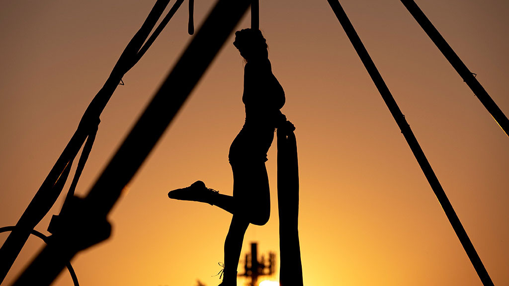 sun sets with circus performer 