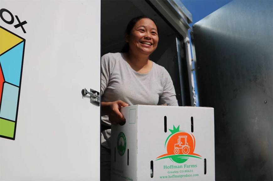 Hanmei Hoffman and her husband Derrick Hoffman farm in Greeley, Colorado, where most of their produce is sold to schools. Here she's moving boxes of cucumbers from a refrigerated container and loading them onto a waiting truck to deliver them to schools along Colorado’s Front Range.